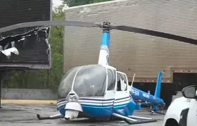 Helicóptero da TV Band faz pouso forçado e atinge caminhão em Guarulhos