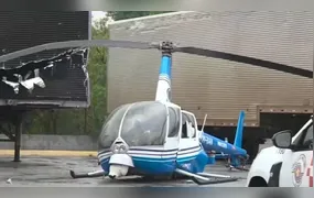 Helicóptero da TV Band faz pouso forçado e atinge caminhão em Guarulhos